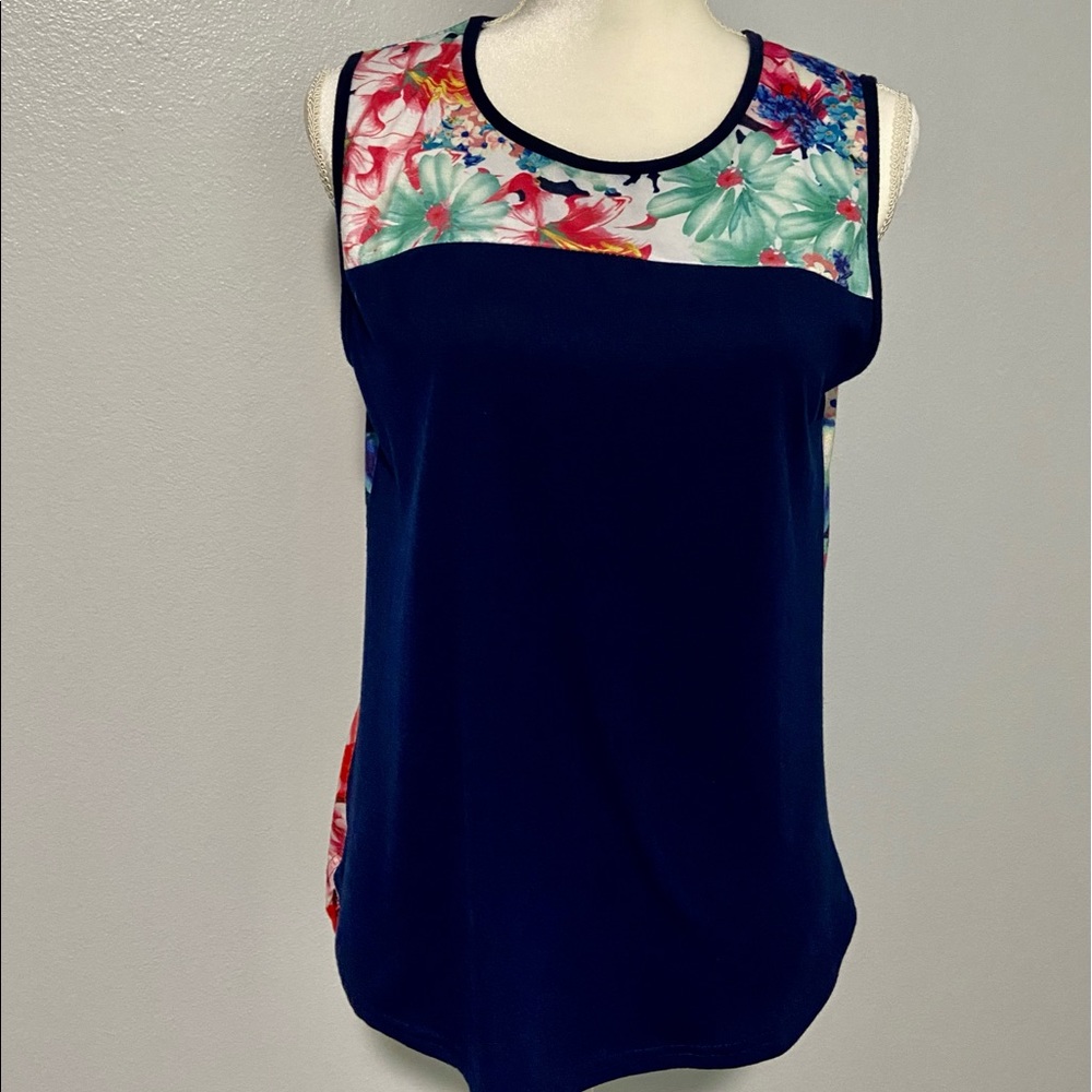 Short sleeve flowered top, size medium, poly cotton blend. Navy blue w/flowers